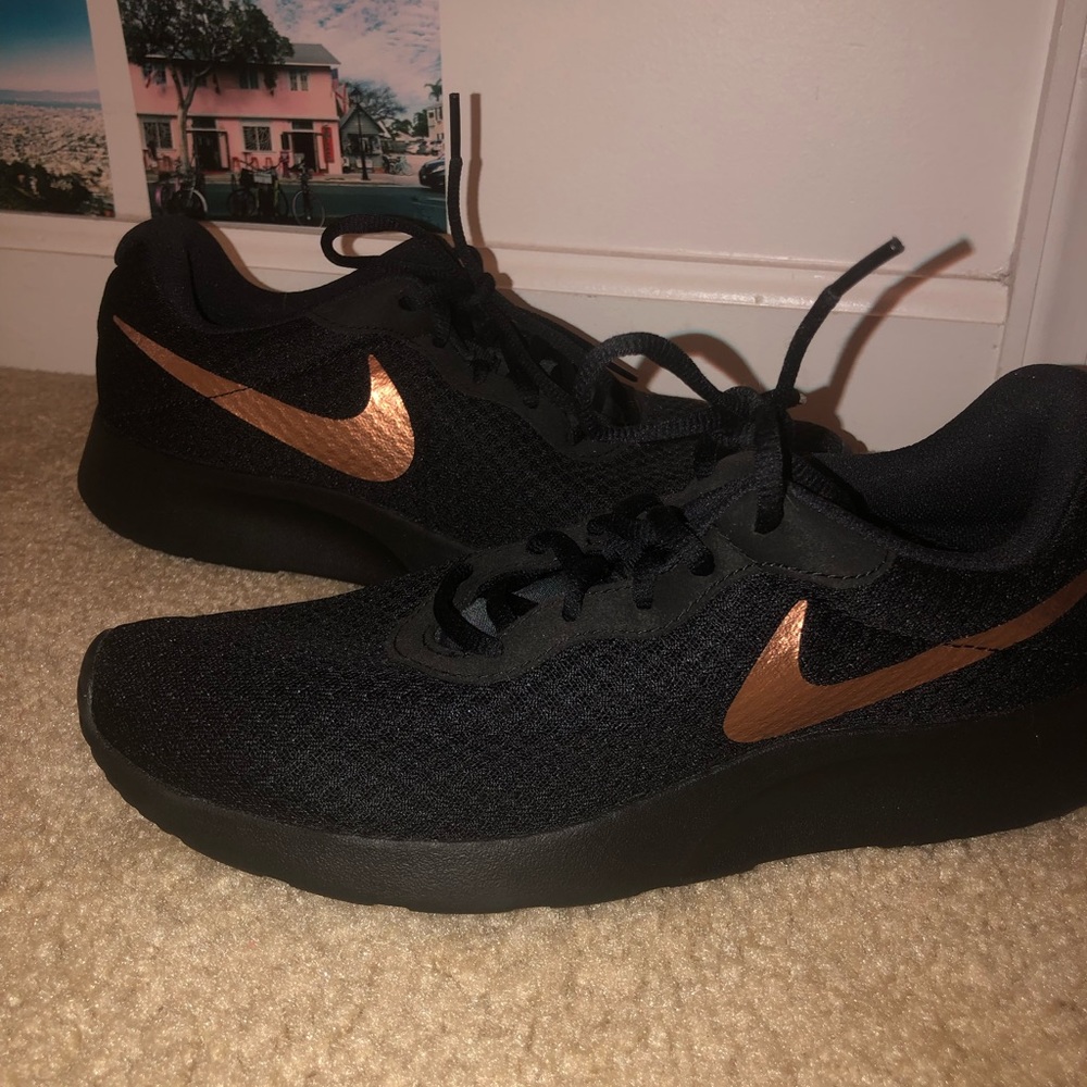 Black and rose gold Nike shoes